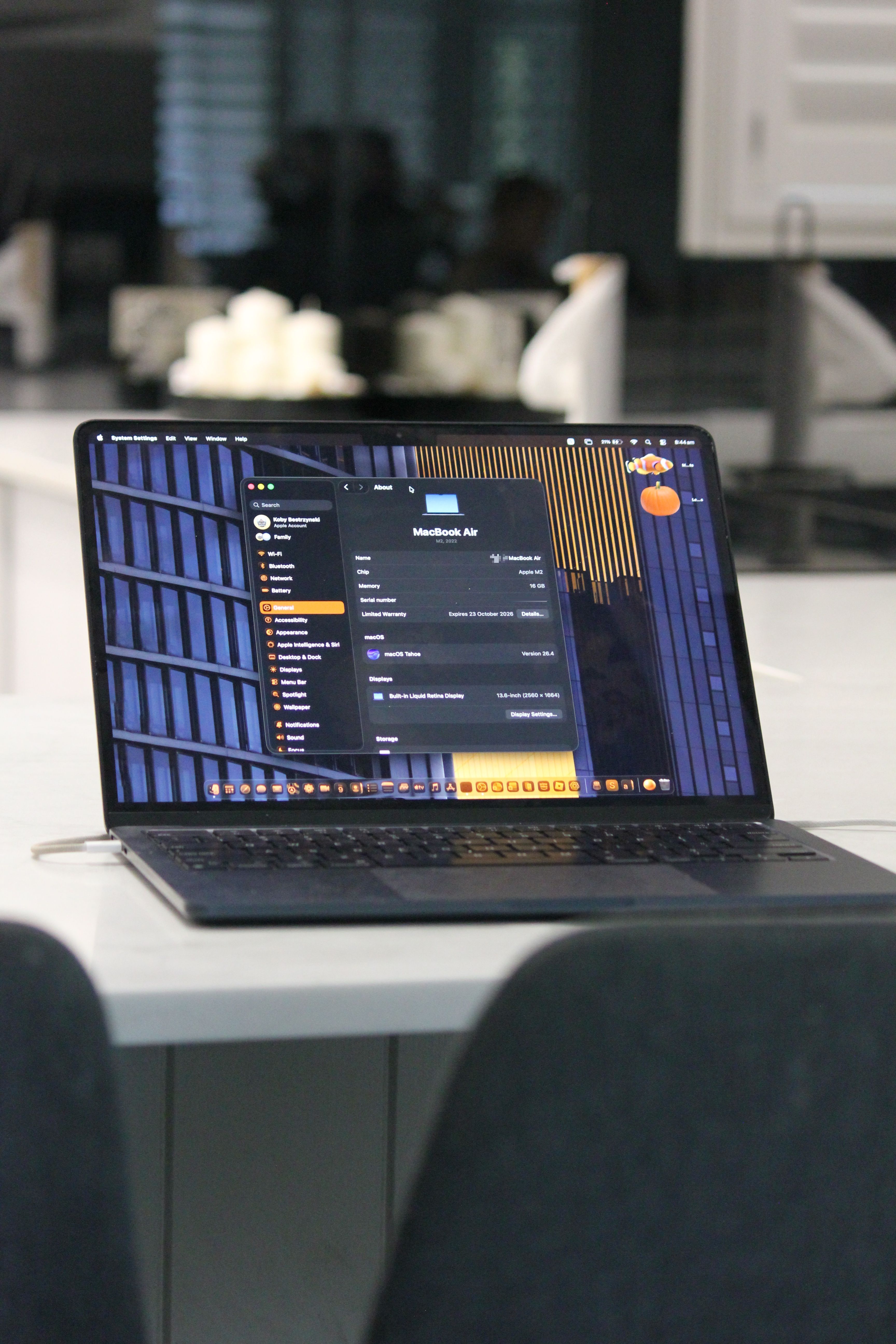 A modern laptop on a sleek office desk with a stylish backdrop, ideal for tech enthusiasts.