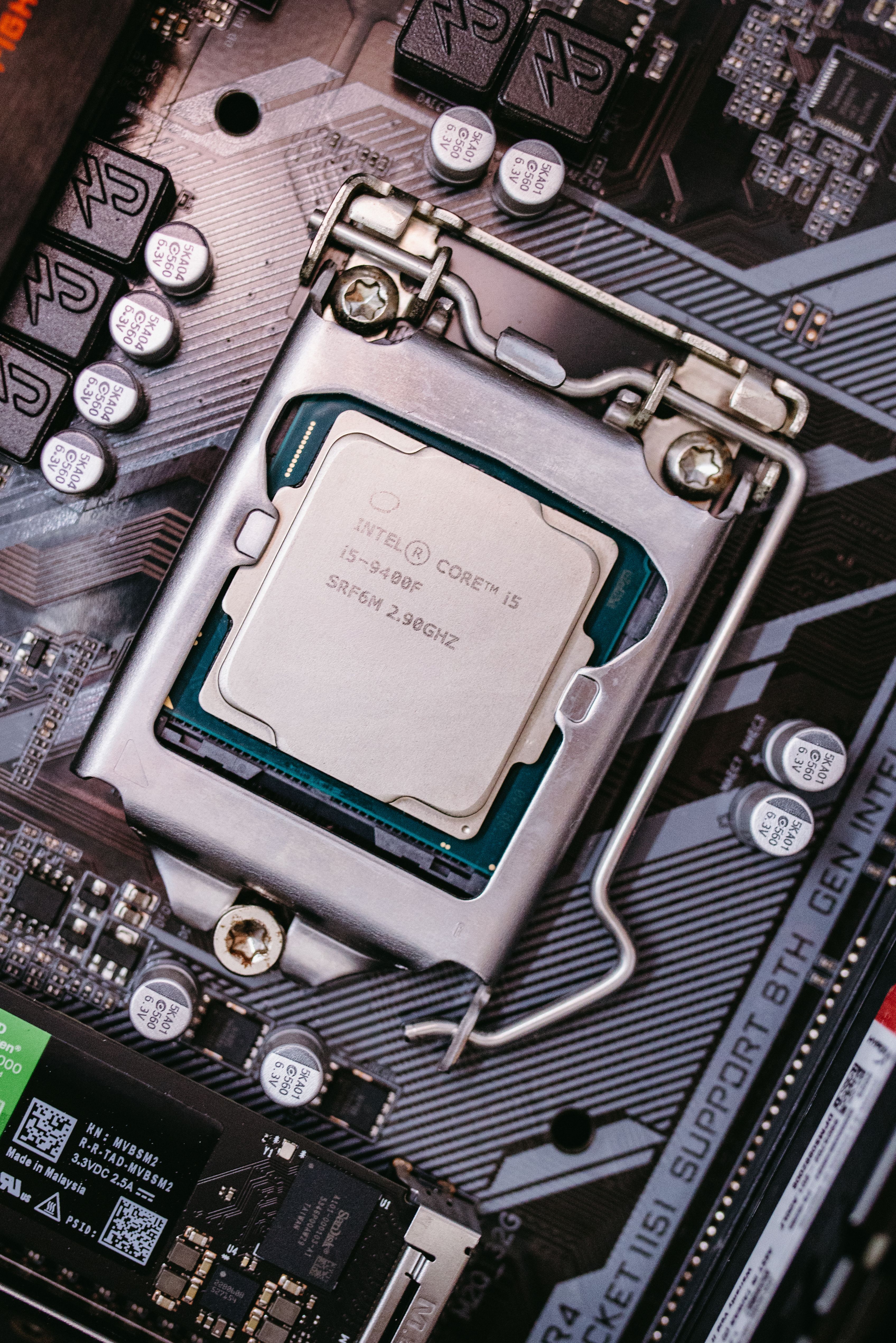 Detailed view of an Intel CPU installed on a motherboard highlighting technological components.